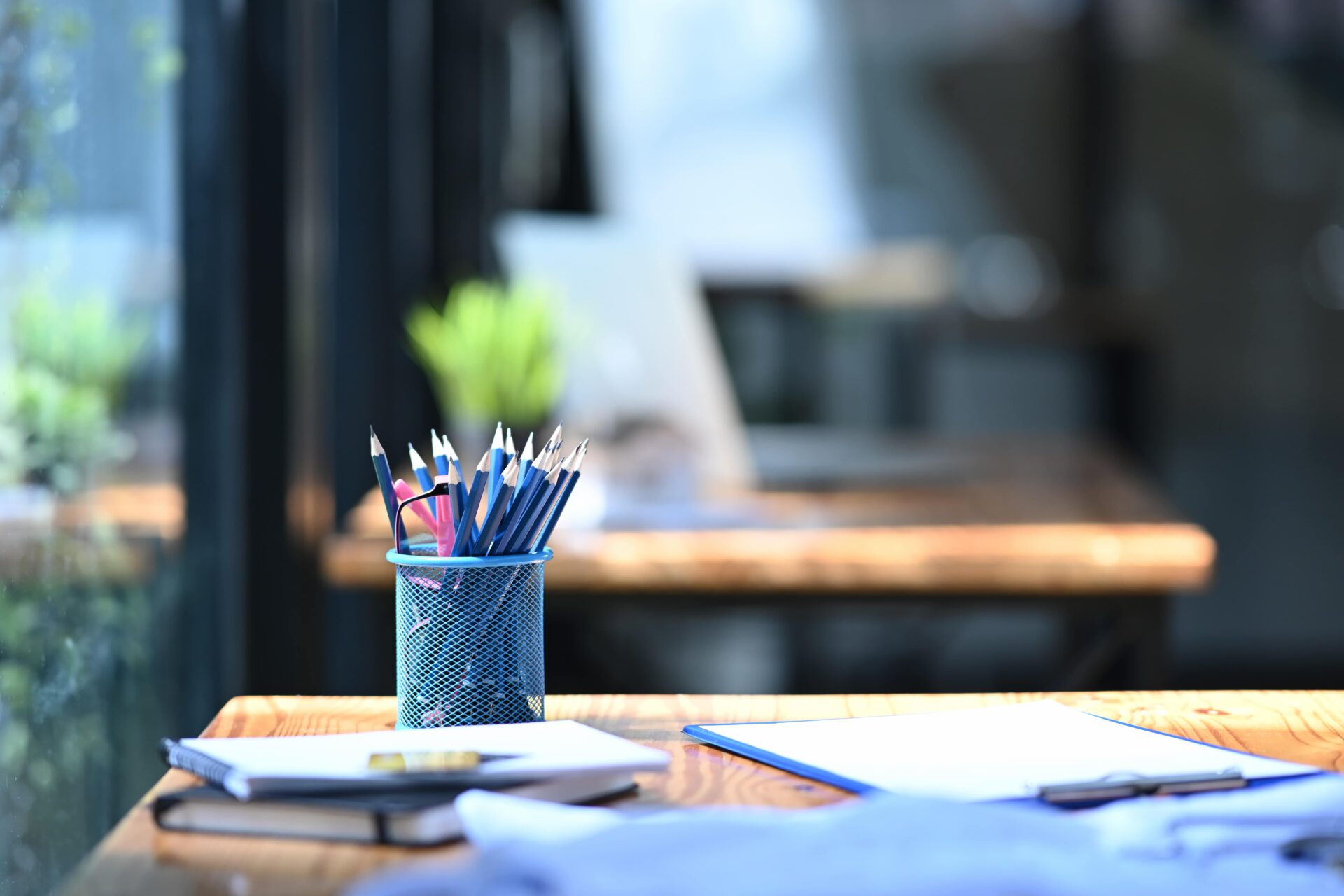 pencil-holder-books-and-financial-documents-on-wo-2024-11-25-14-05-53-utc-min